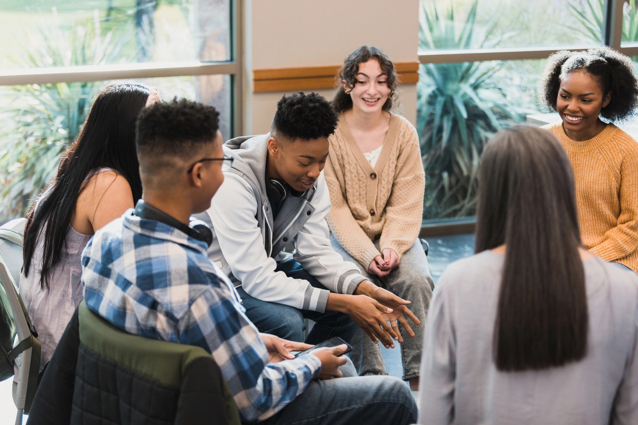 Peers listening supportively during a group conversation